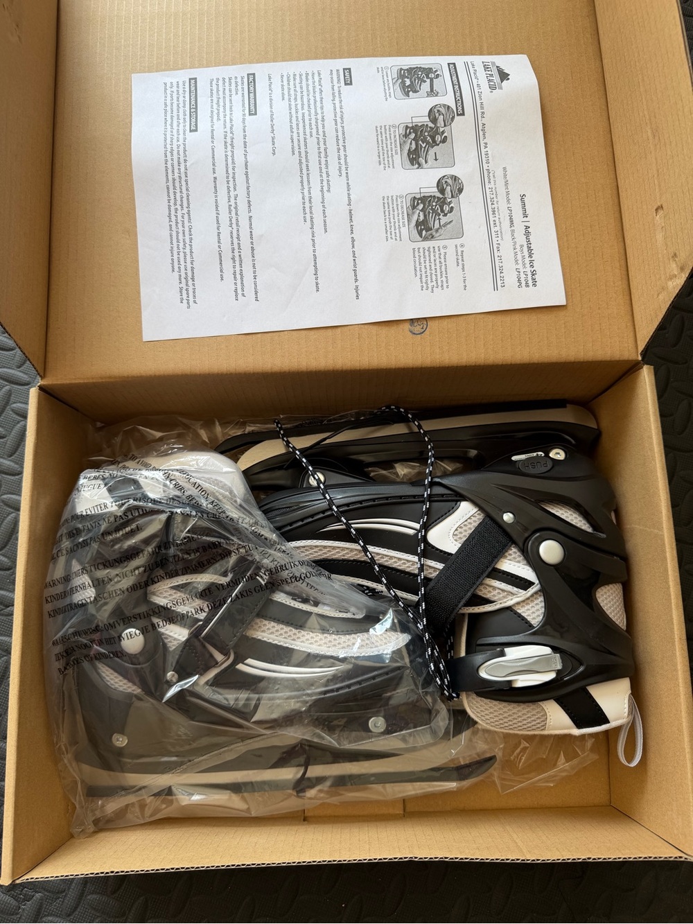 Adjustable Black and White Ice Skates
